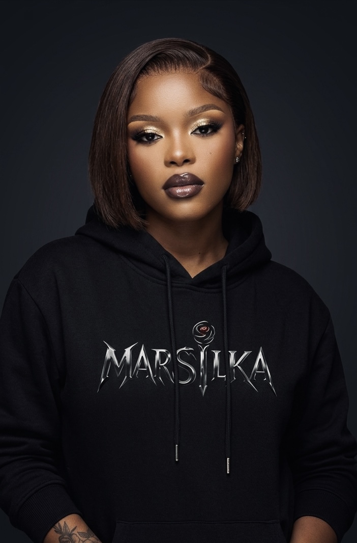 Model in the MARSILKA logo hoodie, studio portrait
